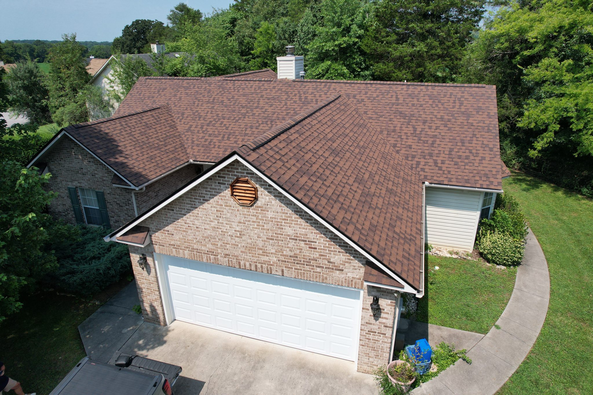 After Maryville Roof Replacement With Burnt Sienna Shingles After a Maryville roof replacement, aerial view of CertainTeed Landmark Burnt Sienna shingles with black drip edge across the detailed roofline.