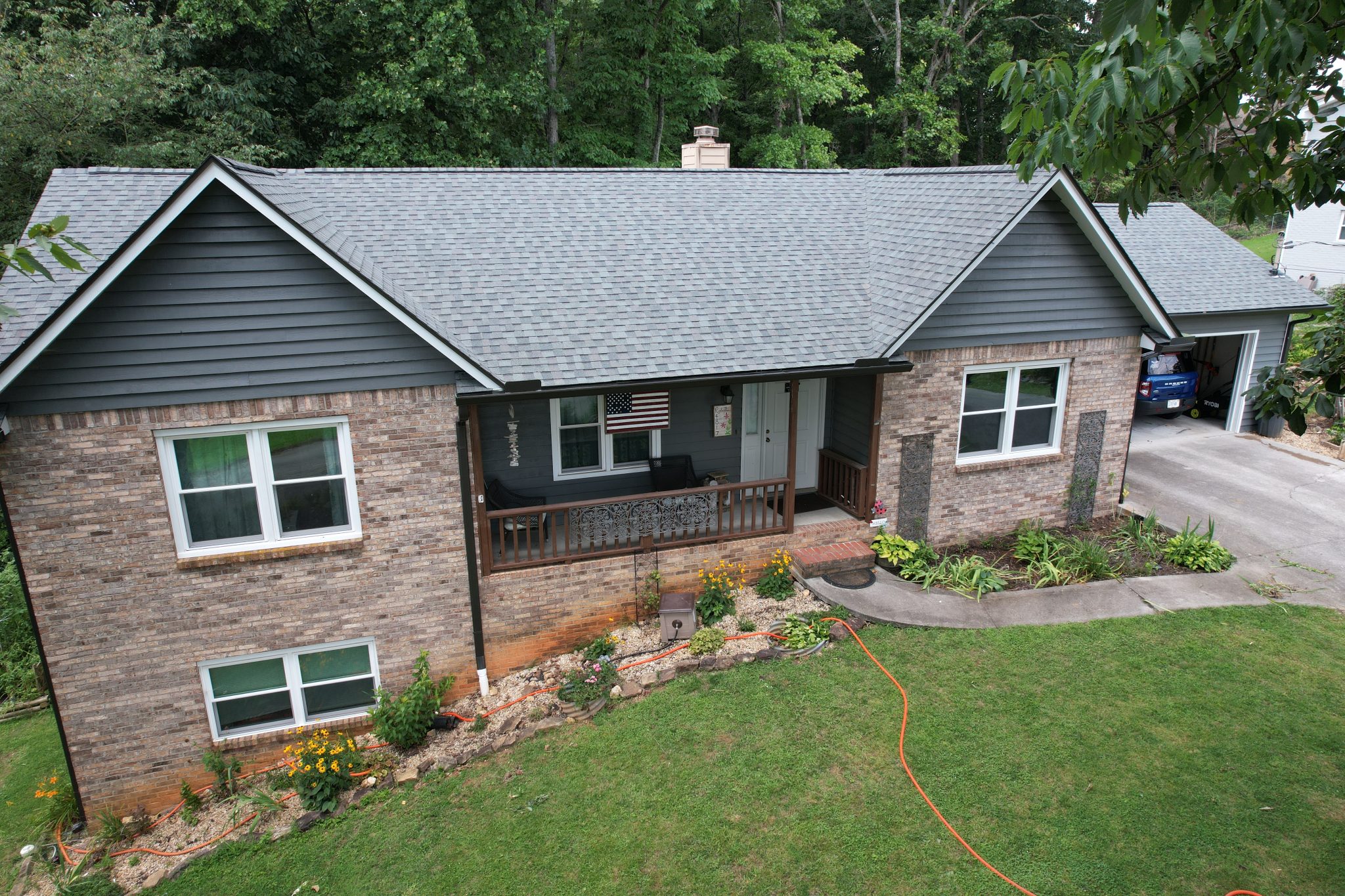 Knoxville Roof Replacement With Colonial Slate Shingles Completed Knoxville roof replacement with CertainTeed Landmark Colonial Slate shingles and six-inch bronze gutters.