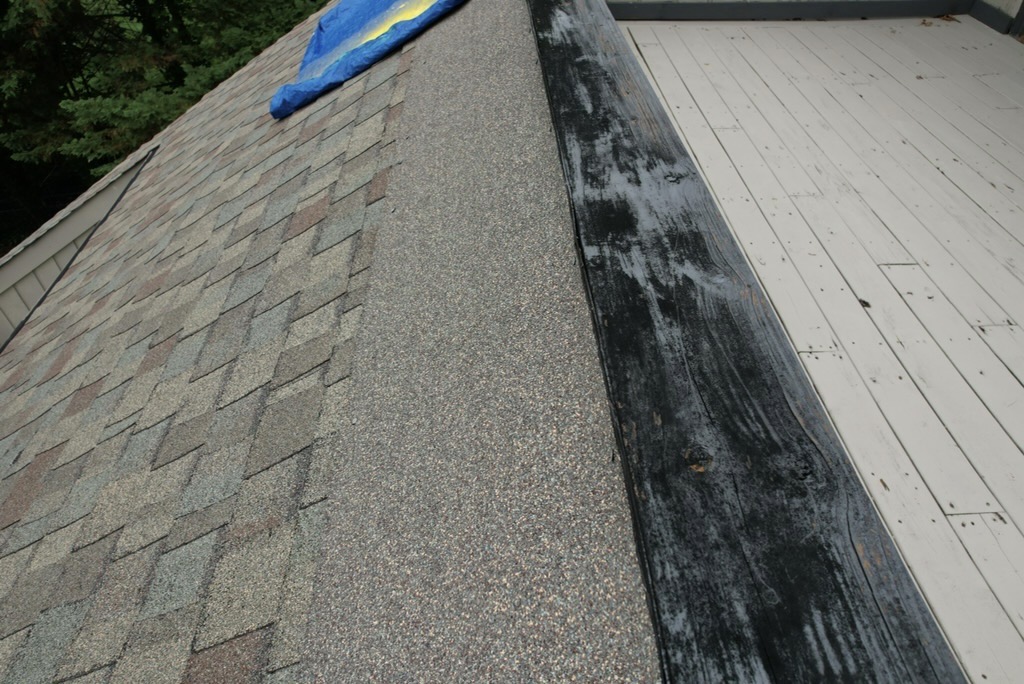 Custom Flashing Made the Difference One of the biggest challenges on this home was the long rail system along the back. These roof-to-wall transitions require careful flashing work. If the flashing is not built correctly, water can work its way behind the roofing materials and into the home. For this project, we fabricated custom rail flashing systems specifically for the home. That gave these areas the protection they needed while creating a clean finished appearance. Good roofing is about much more than shingles. The details around flashing often determine how well a roof performs over time. Custom Flashing Made the Difference</p>
<p>One of the biggest challenges on this home was the long rail system along the back.<br />
These roof-to-wall transitions require careful flashing work. If the flashing is not built correctly, water can work its way behind the roofing materials and into the home.<br />
For this project, we fabricated custom rail flashing systems specifically for the home. That gave these areas the protection they needed while creating a clean finished appearance.<br />
Good roofing is about much more than shingles. The details around flashing often determine how well a roof performs over time.<br />