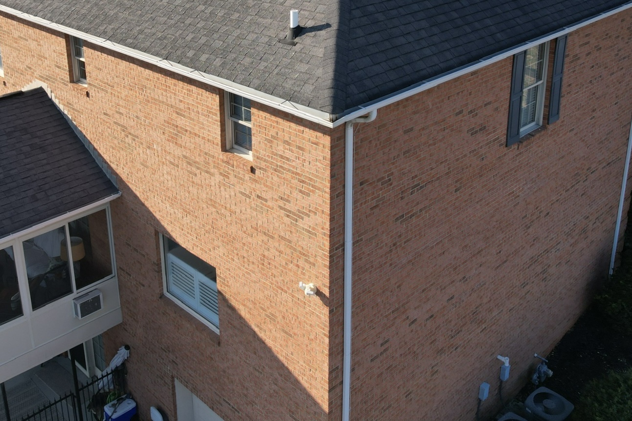 Close view of a gutter system on a home, highlighting the value of seamless gutters Knoxville, TN homeowners choose for fewer leaks and cleaner lines.