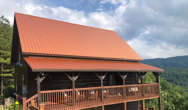 A beautiful copper-colored metal roof installation by Mountain View Exteriors, near the Smoky Mountains.