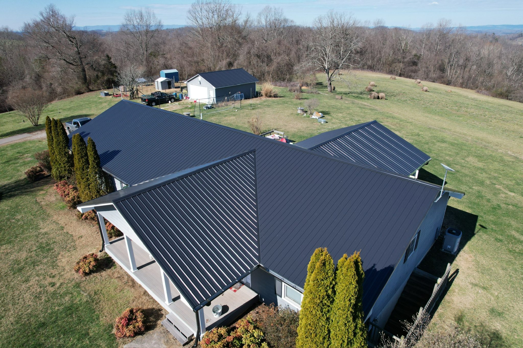 A Knoxville home featuring a standing seam metal roof with crisp vertical seams, ridge venting, and clean flashings, metal roofing in Knoxville, TN.