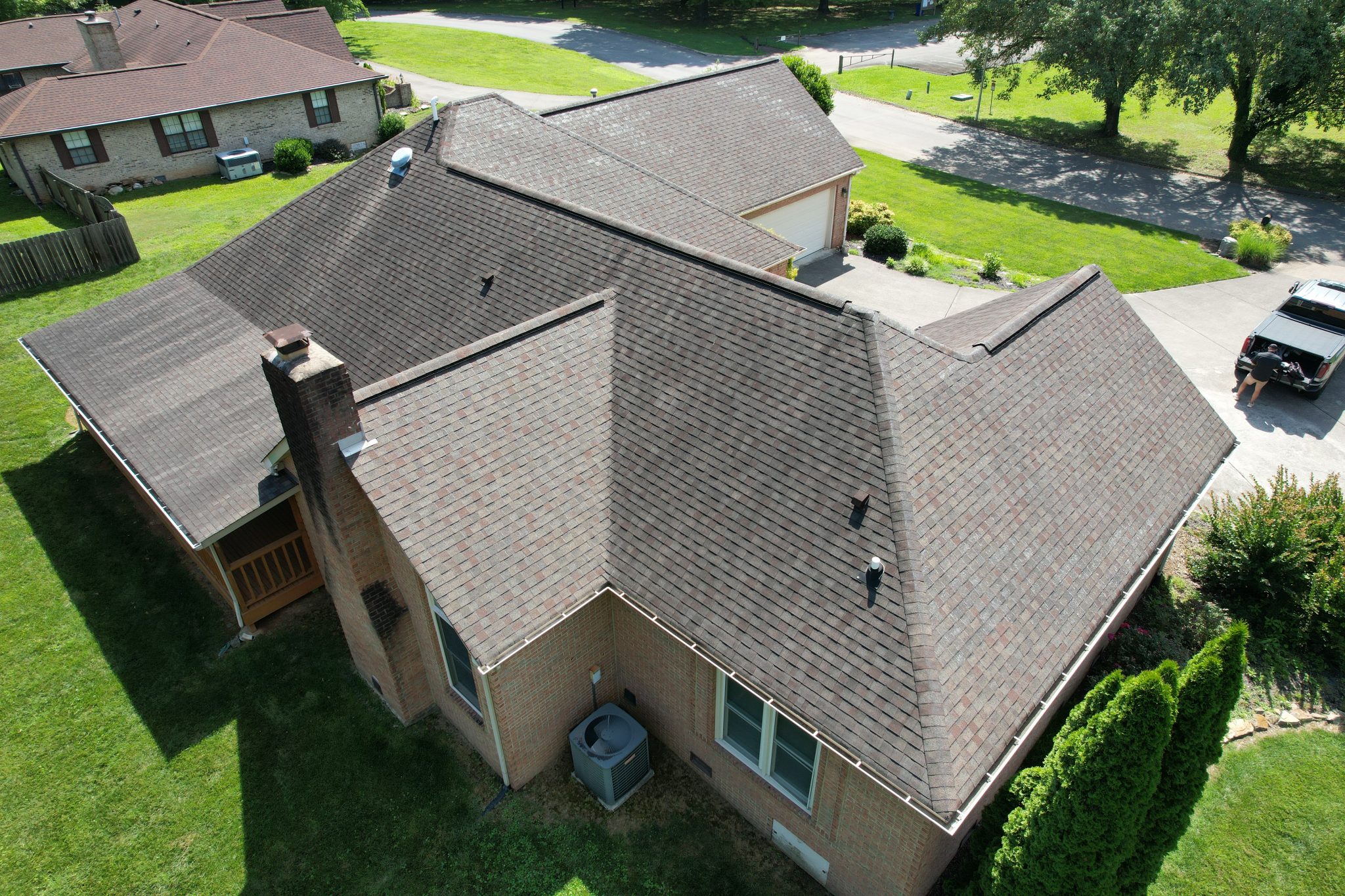 Before Roof Replacement in Oak Ridge, TN Aging shingles before a roof replacement in Oak Ridge, TN