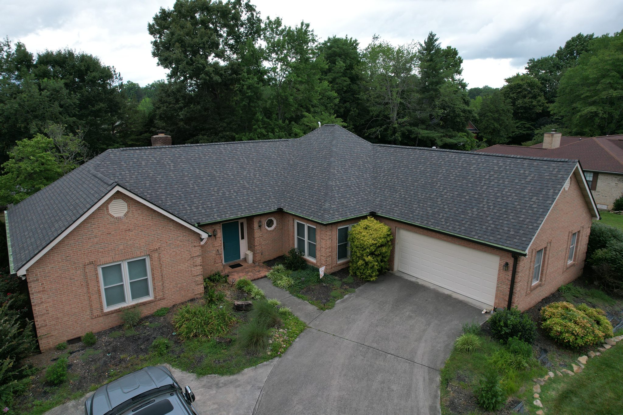 Completed Roof Replacement in Oak Ridge, TN New Driftwood shingles after a roof replacement in Oak Ridge, TN